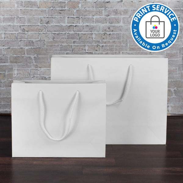 White Kraft Paper Carrier Bags from stock at Midpac Packaging. The bags are available plain or printed with your logo